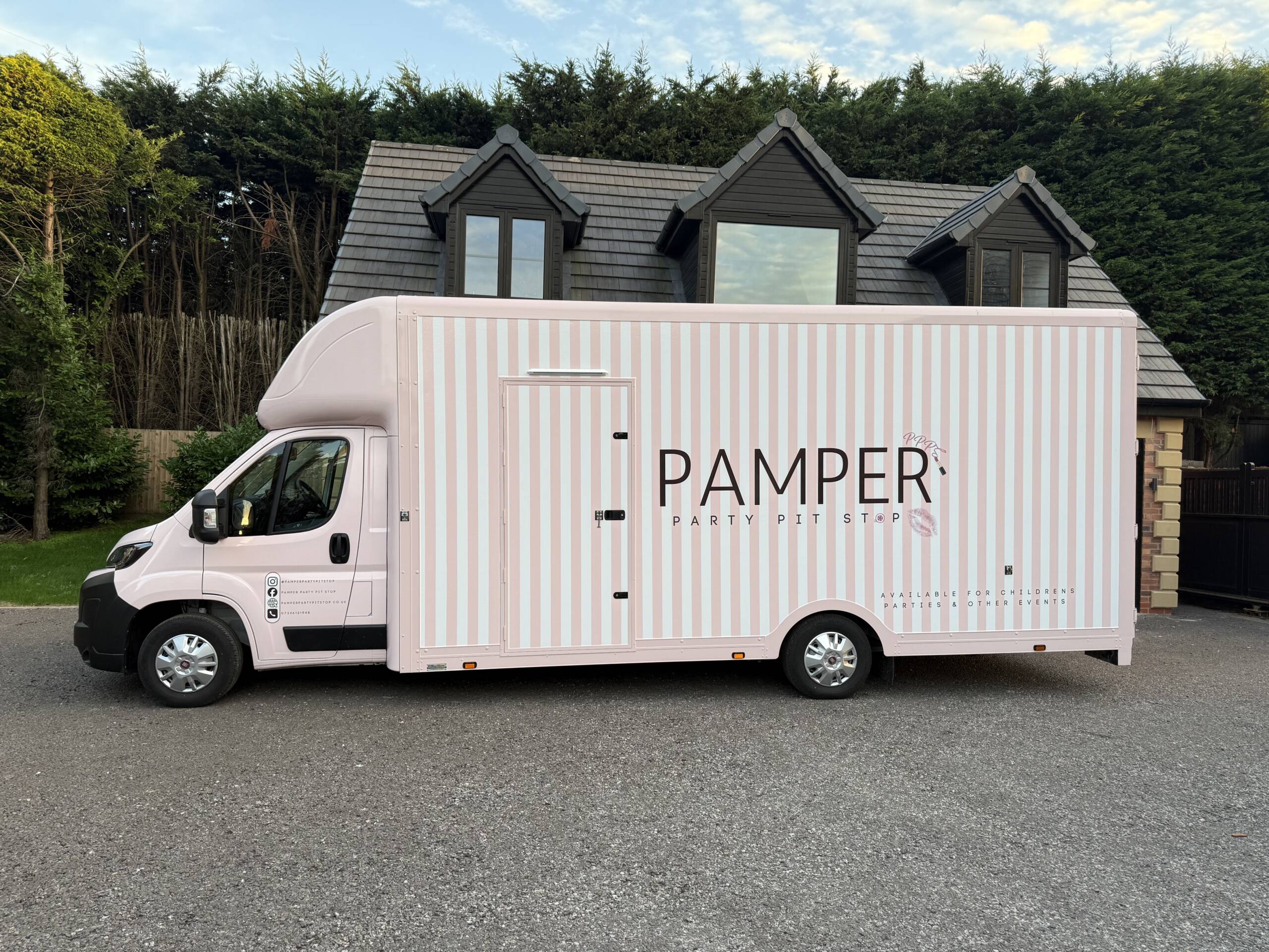 The real pink Pamper Party Pit Stop van